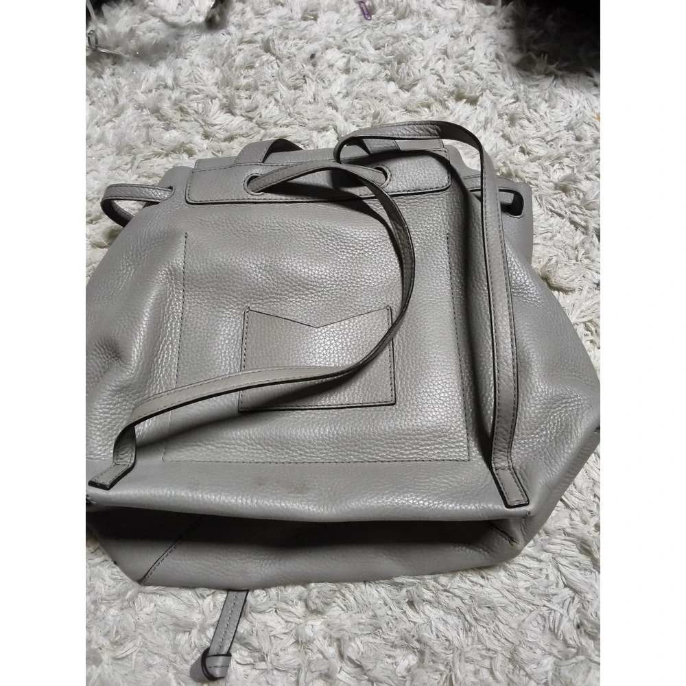 15.Michael Kors Grey Pebbled Leather Drawstring Backpack Flap Bag Silver MK Logo